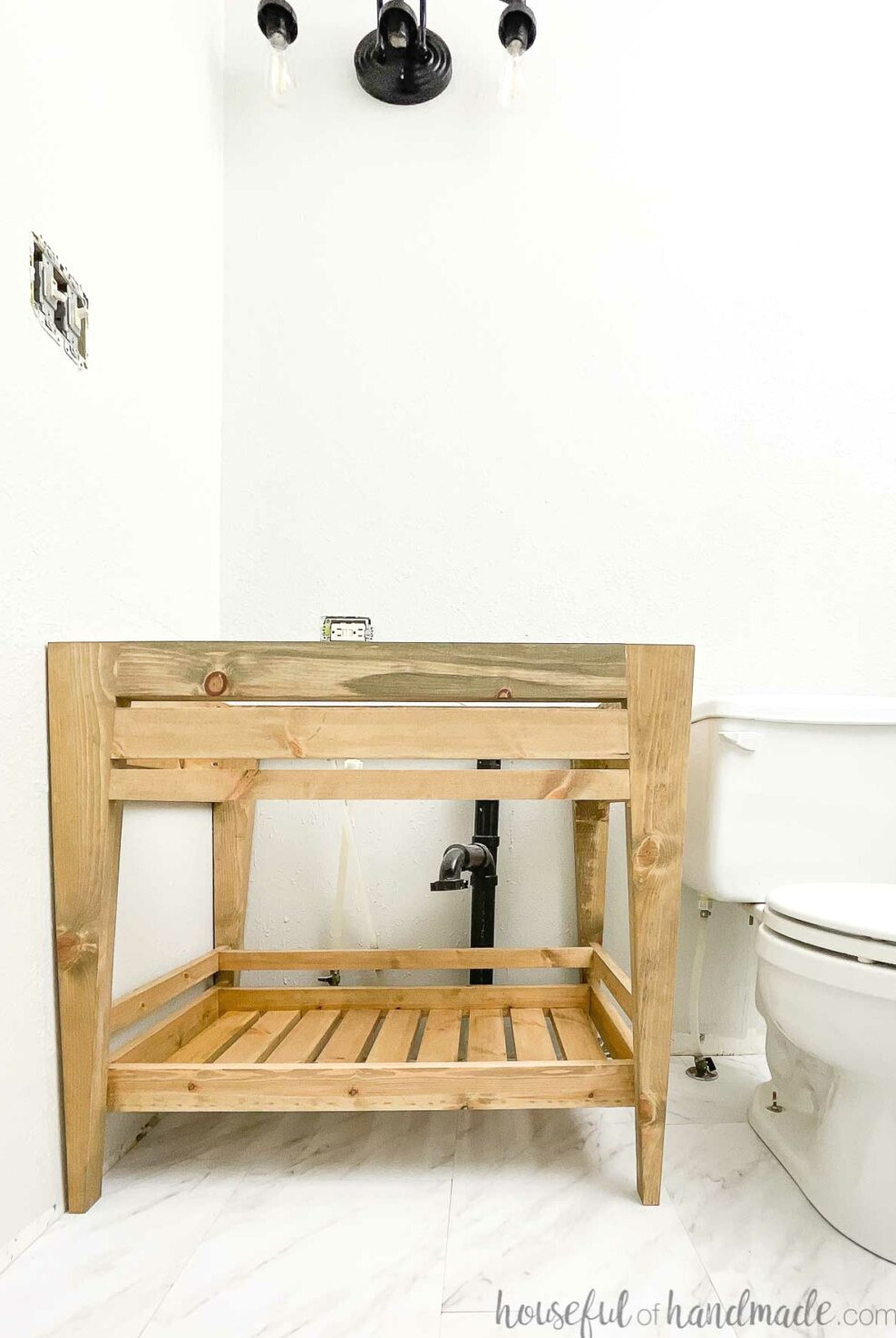 Small bathroom featuring marble-look vinyl flooring and a DIY bathroom vanity built affordably.