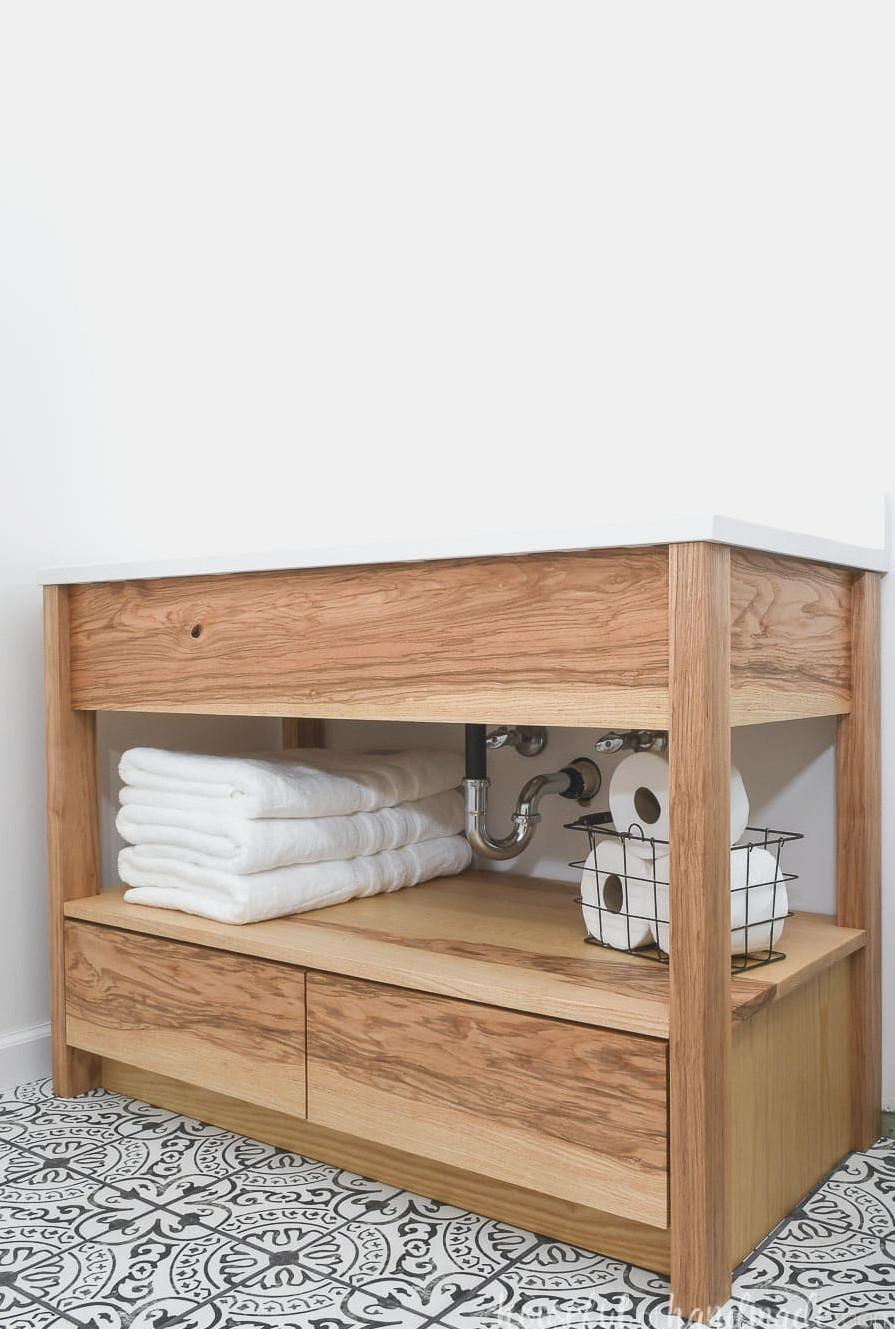 DIY 42" ash wood bathroom vanity featuring an open towel shelf and lower drawers. 
