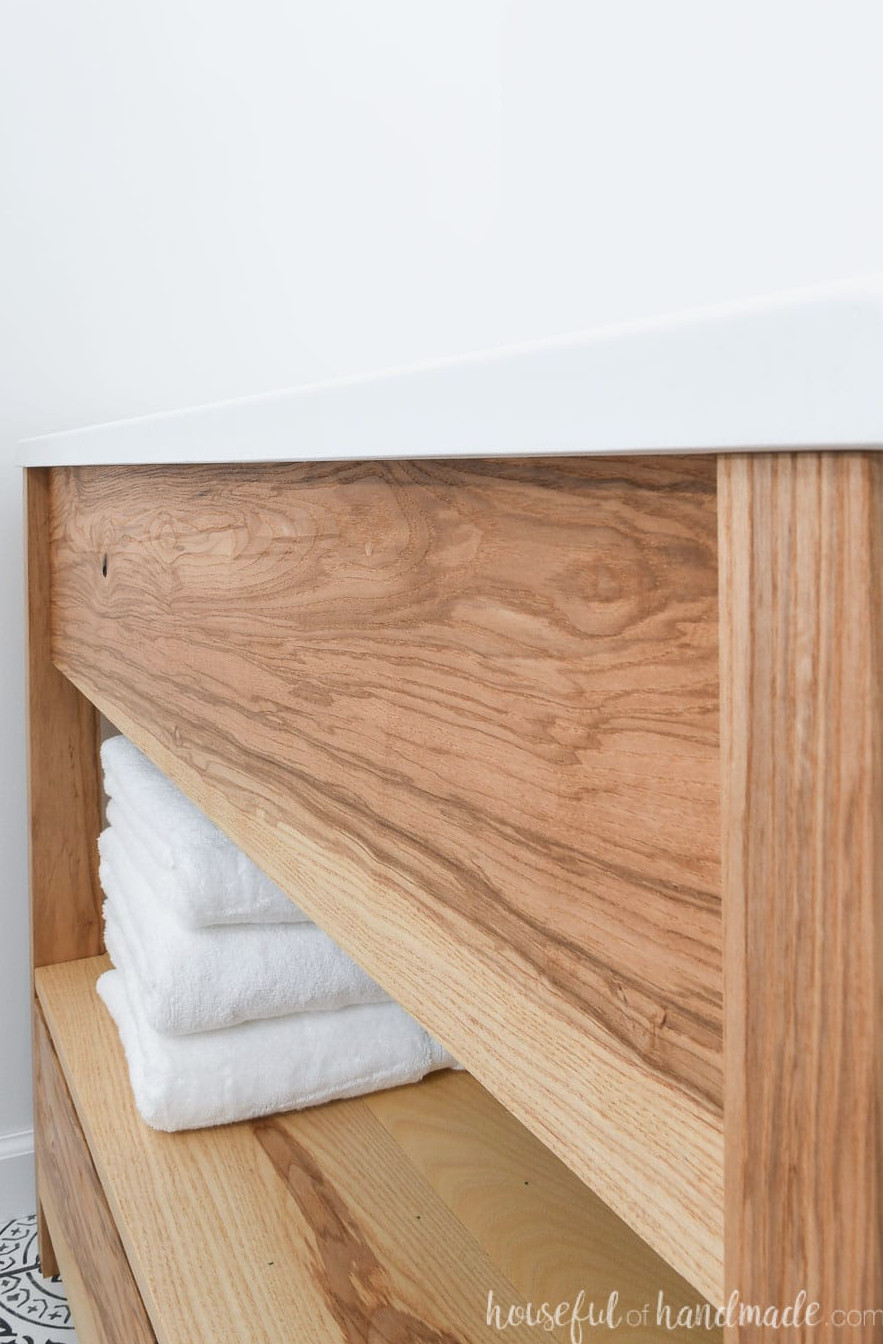 A close view of the ash wood grain used for constructing the DIY bathroom vanity. 