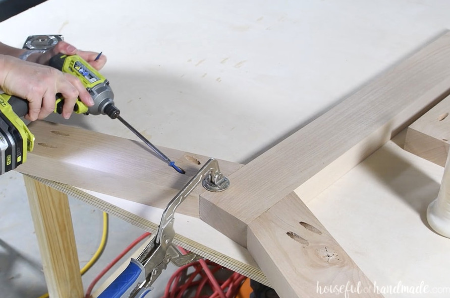 Attaching the second side base to the center base with pocket holes.