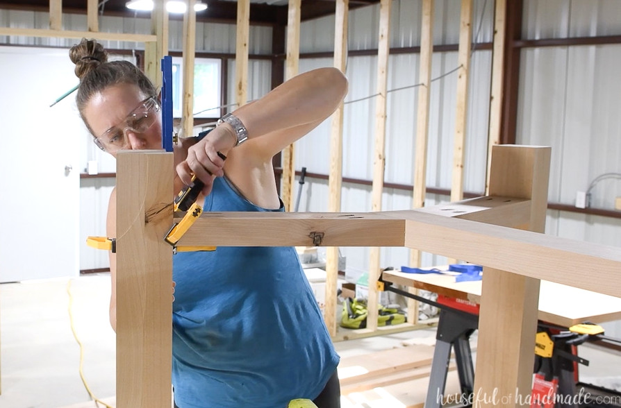 Attaching the base to the legs.