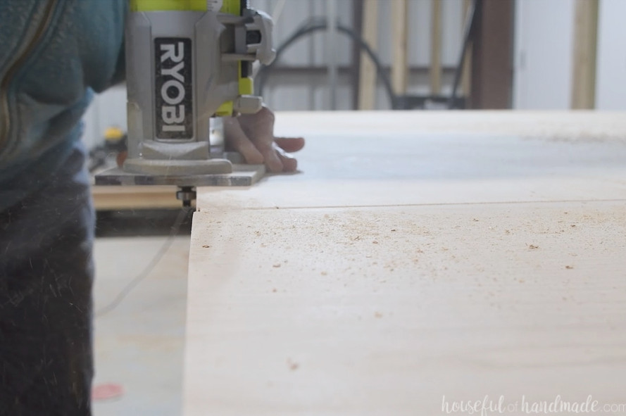Routing a round over on the top of the dining table with the leaves installed.