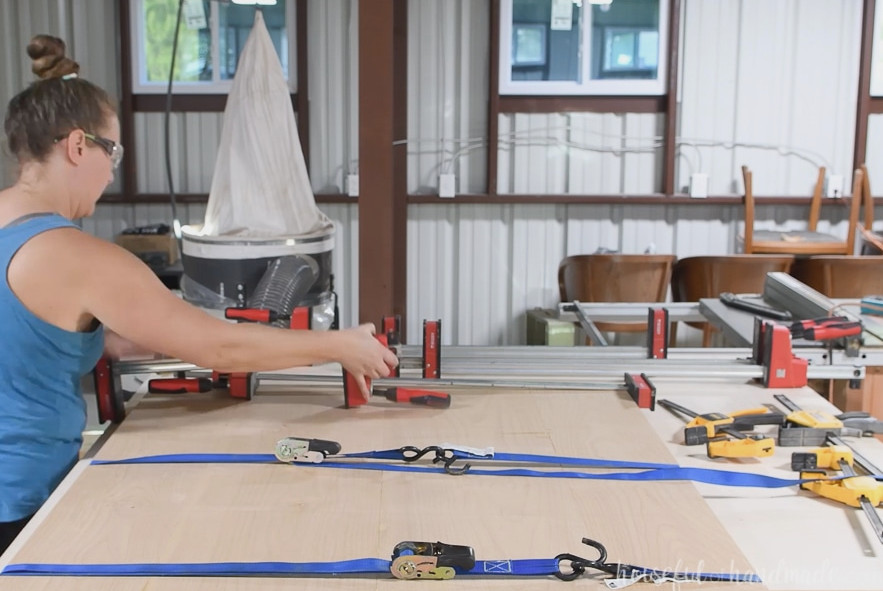Clamping the final table top with ratchet straps and multiple clamps.