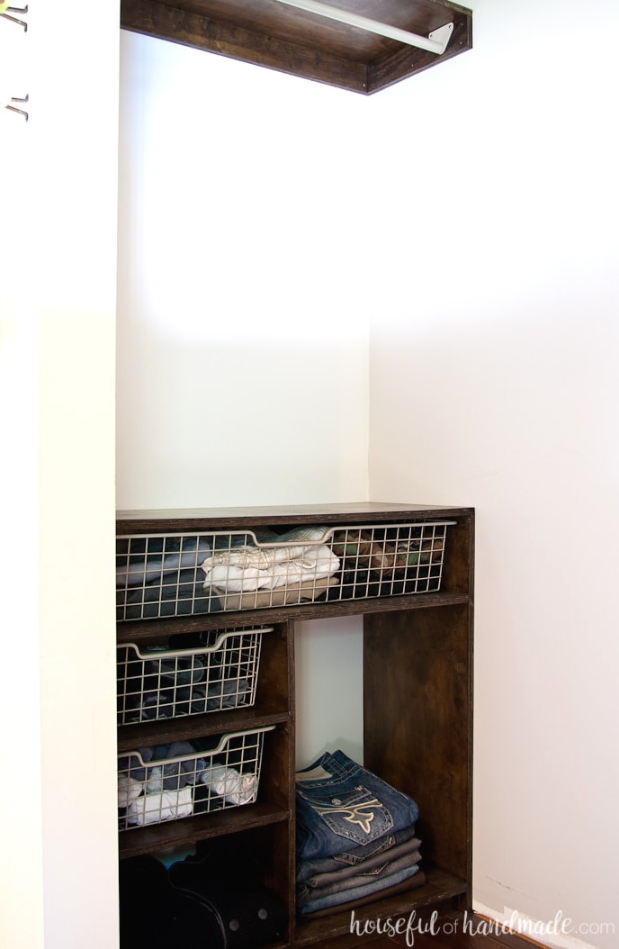 Complete view of the plywood closet organizer constructed from these plans and fitted inside the closet.