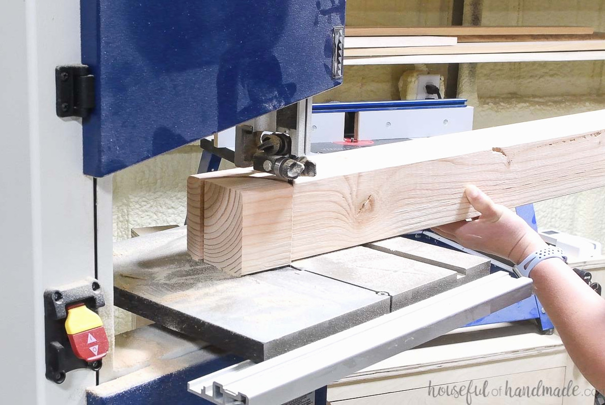 Cutting the curve on the top post with a bandsaw.