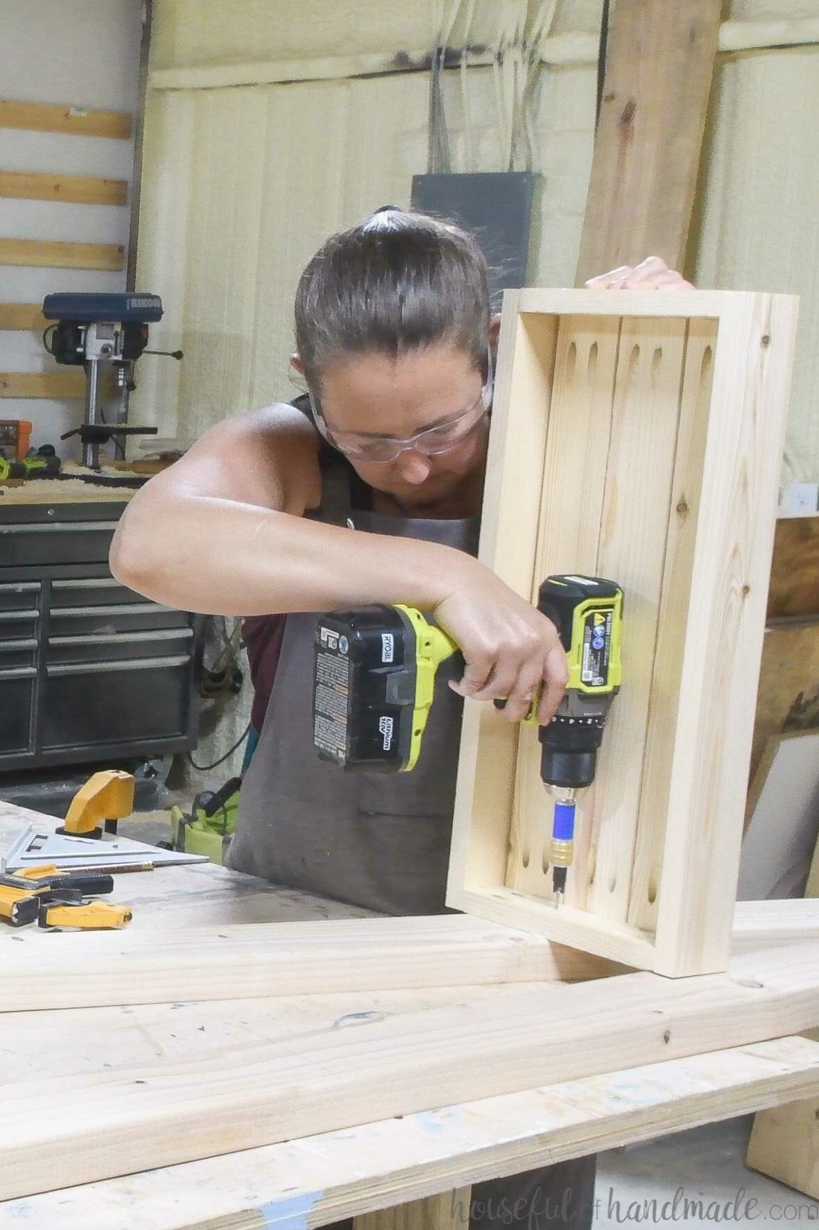 Fastening the first planter box frame to the ladder side.