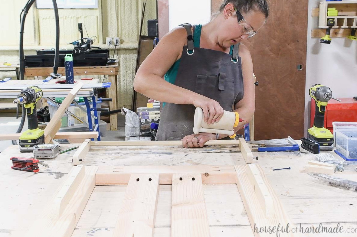 Glueing a dowel into the holes on the curved boards.