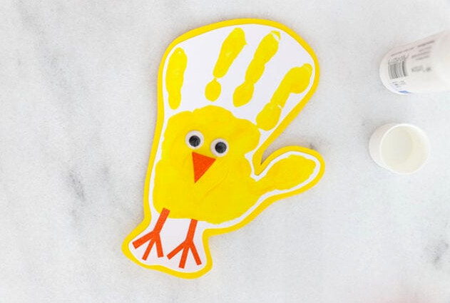 Eyes and beak glued onto handprint