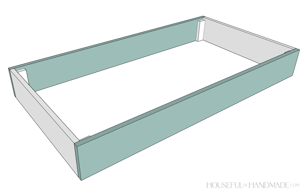 Attaching all the pieces together to build the raised bed.