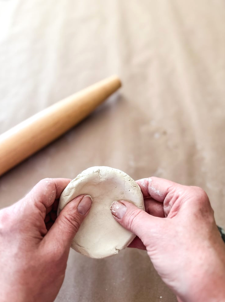 shaping clay into a mushroom shape