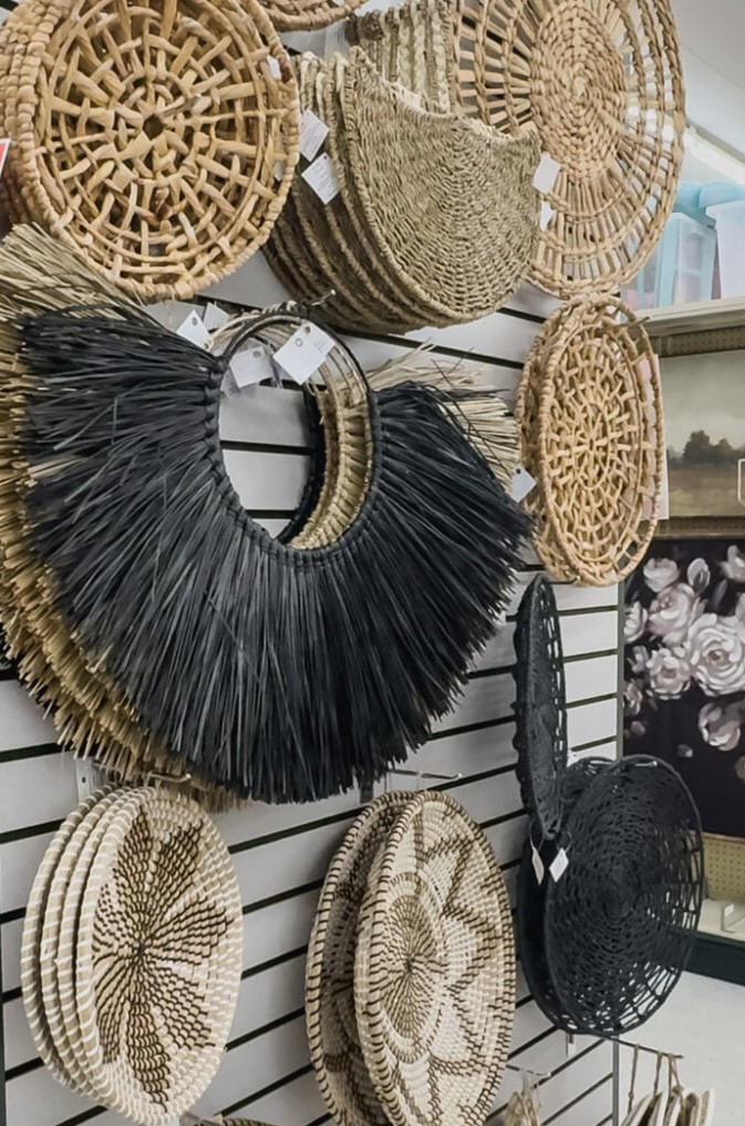 an endcap in Hobby Lobby filled with woven wall art.