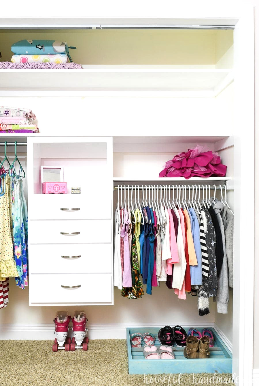 Clothing closet organized with DIY closet system with drawers.