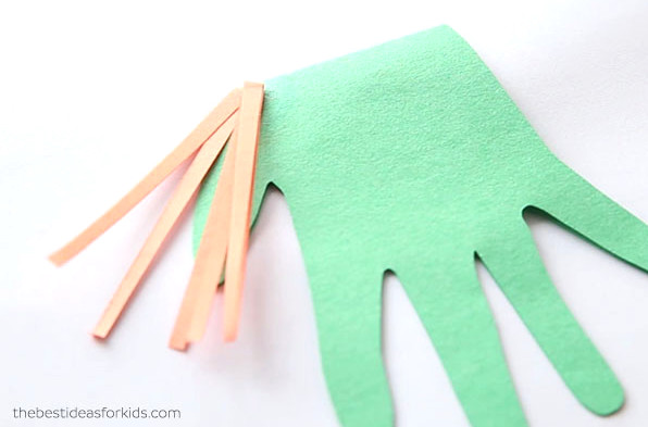 Glue down paper strips for hair