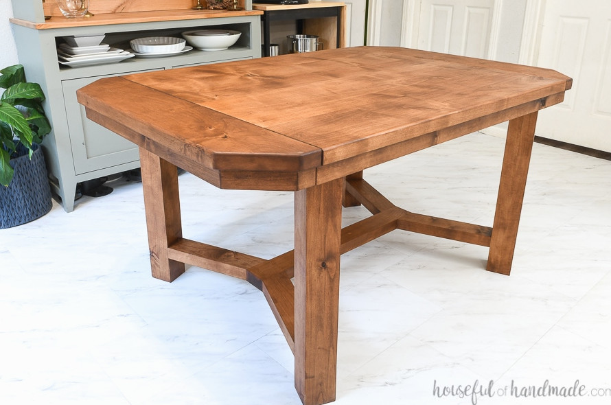 Dining table with breadboard ends that open to hold leaves and sealed with matte unfinished look sealer.