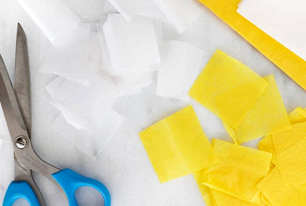 Cut tissue paper into squares