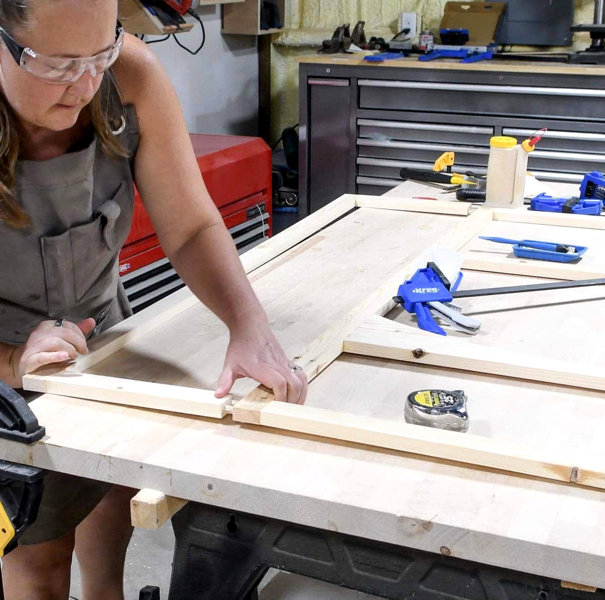 Joining the second cabinet face frame to the side of the first cabinet. 