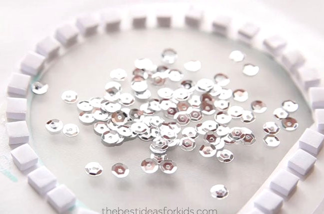 Sequins inside snow globe card