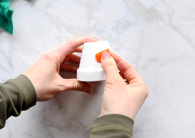 Gluing nose onto pot