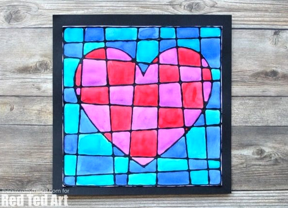 Black Glue Heart Art Project - Stained Glassed Heart Art. How beautiful is this art projects for kids this Valentine's Day? Would make a gorgeous gift too! #blackglue #heartart #valentinesday #artprojects #kidscrafts #art