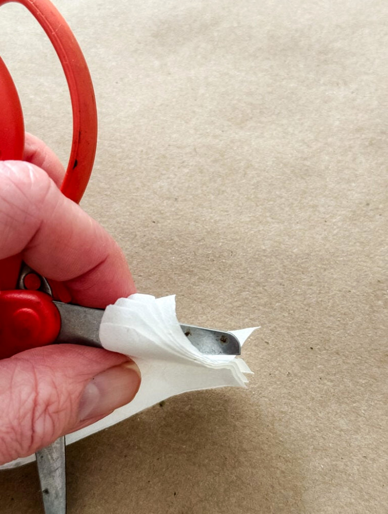 curling the borders of paper flowers