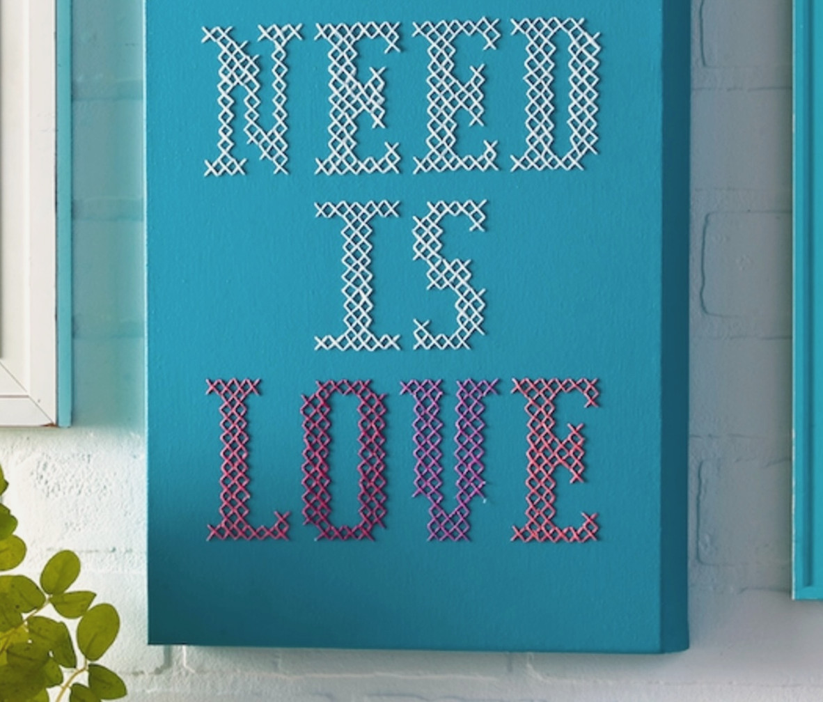 close up of cross stitching on canvas
