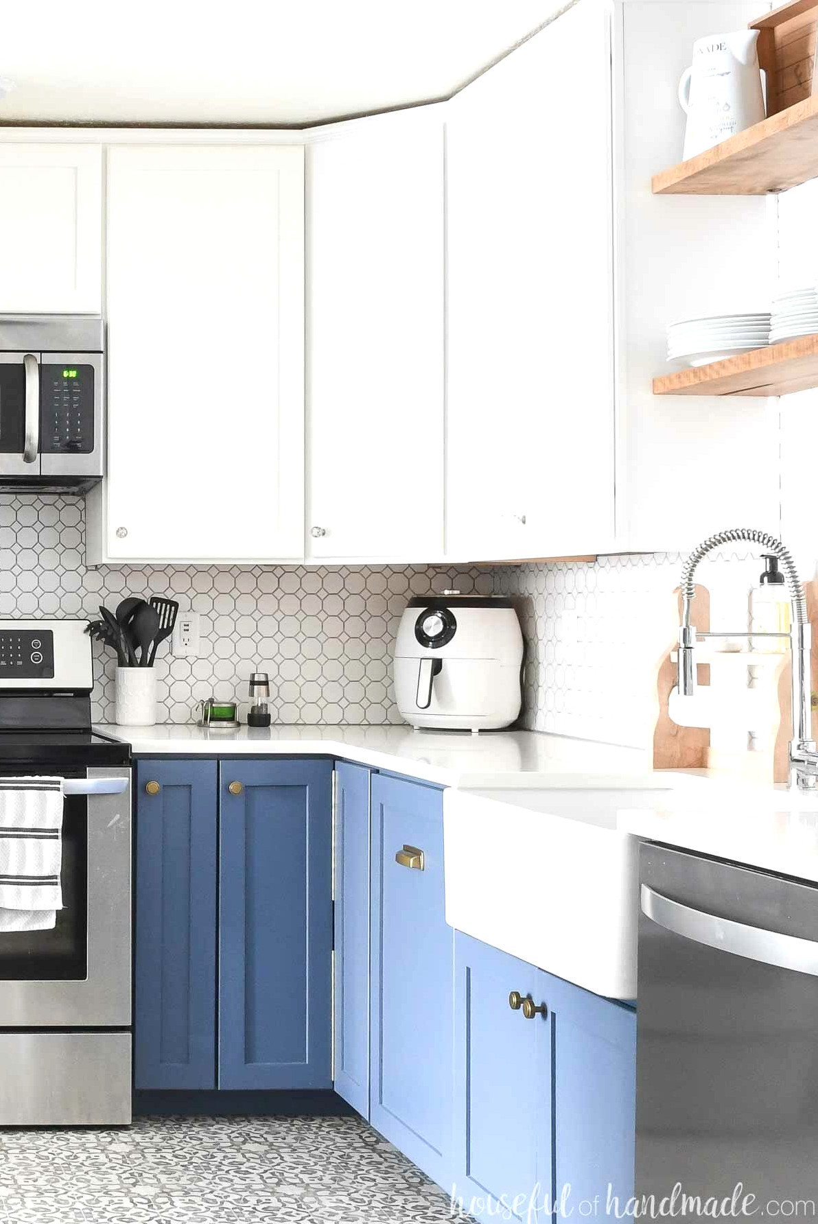 DIY corner cabinets in a kitchen with blue base cabinets and white wall cabinets.