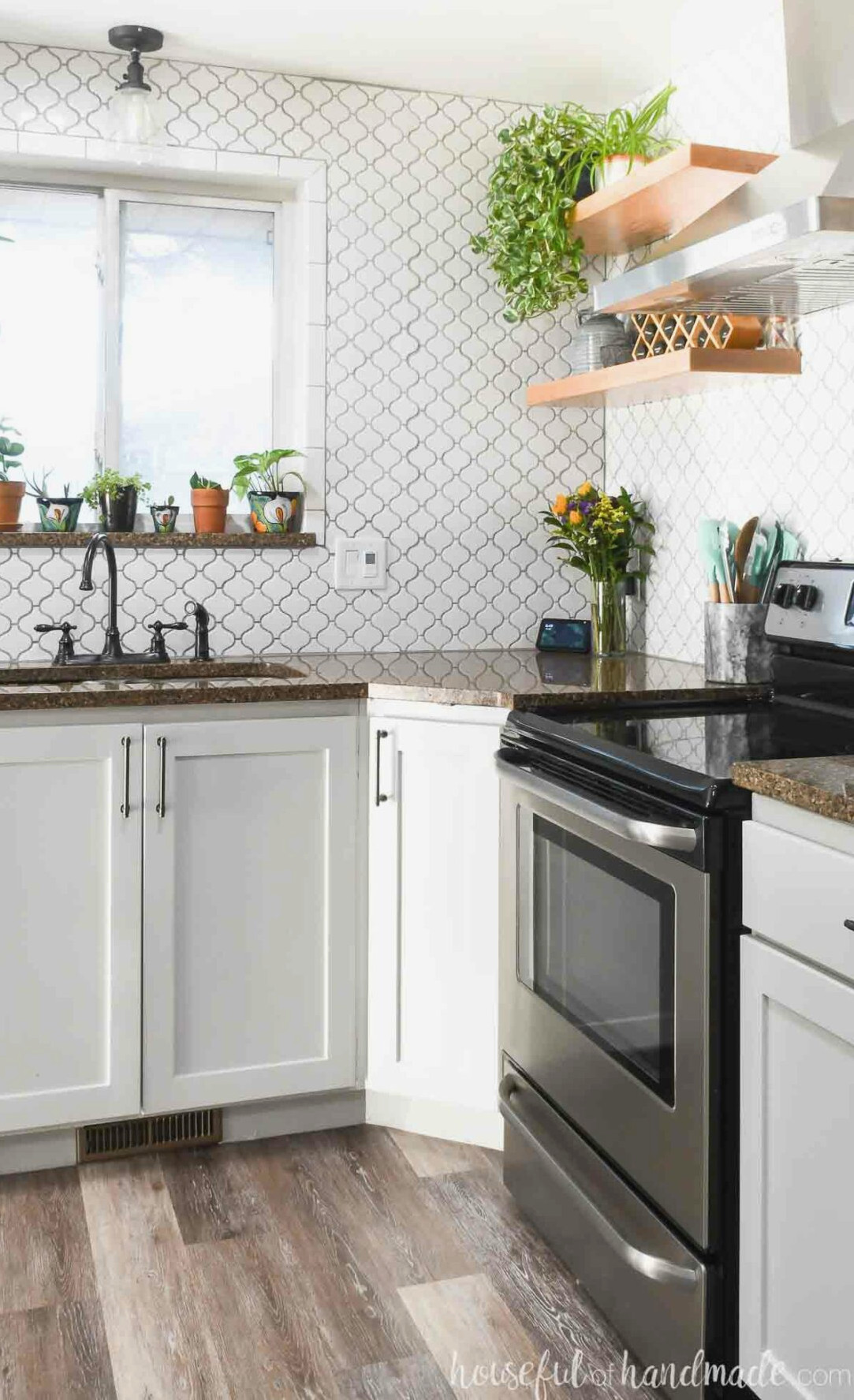 Modern kitchen with open shelves on the walls above diagonal base cabinet and stove.
