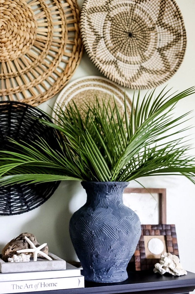 a deep blue vase on a mantle