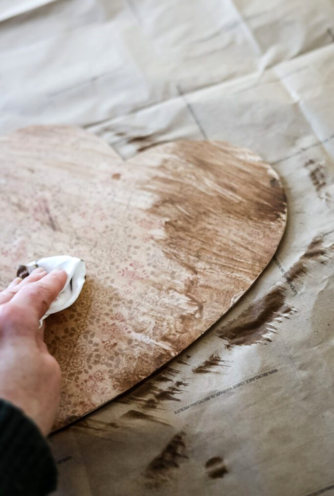 wiping off dark wax from vintage hanging heart project