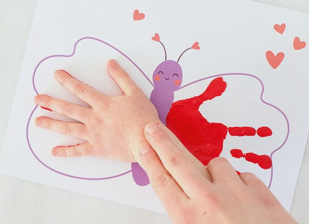 Pressing a butterfly wing handprint