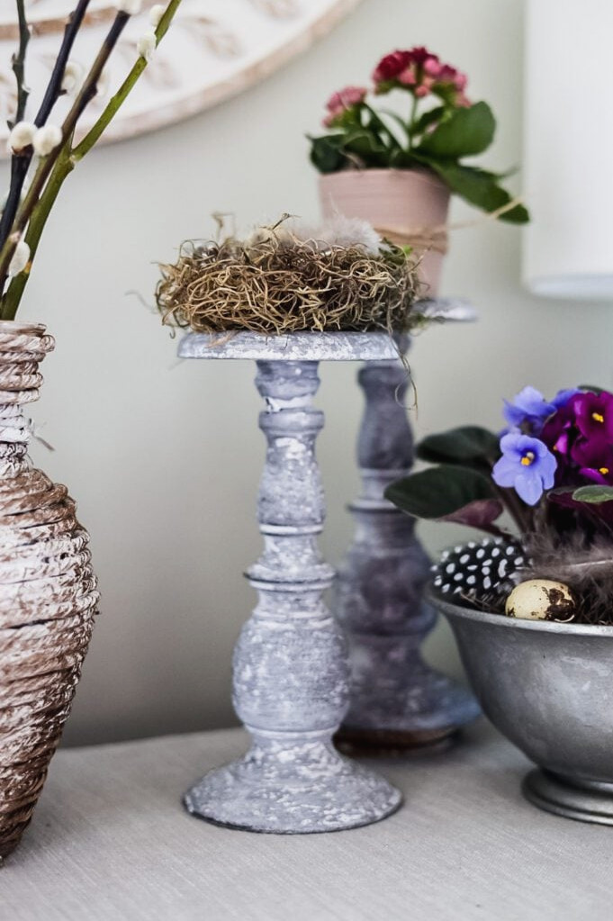 candlestick with mini bird's nest on top