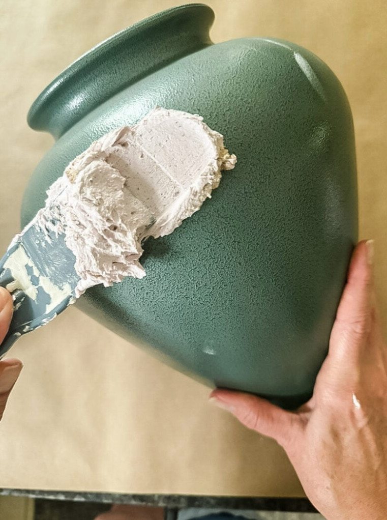 covering a vase with joint comound to create a textured effect like pottery.
