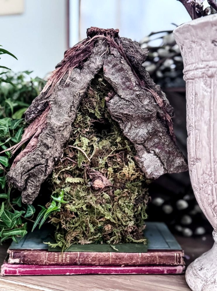 moss covered birdhouse