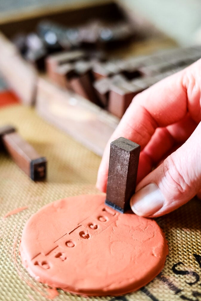 stamping clay with plant words