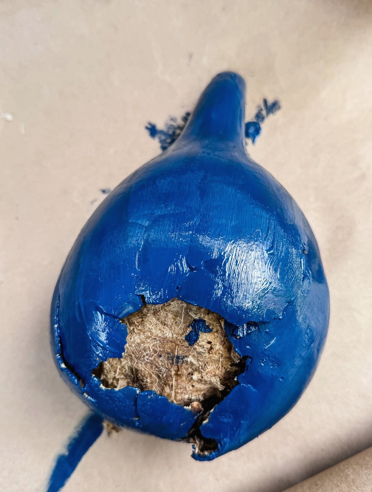 painting a gourd as a fairy house