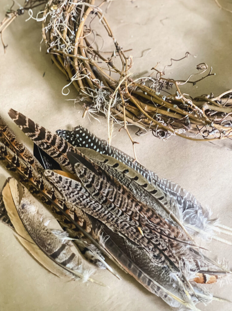 assorted feathers and a wreath