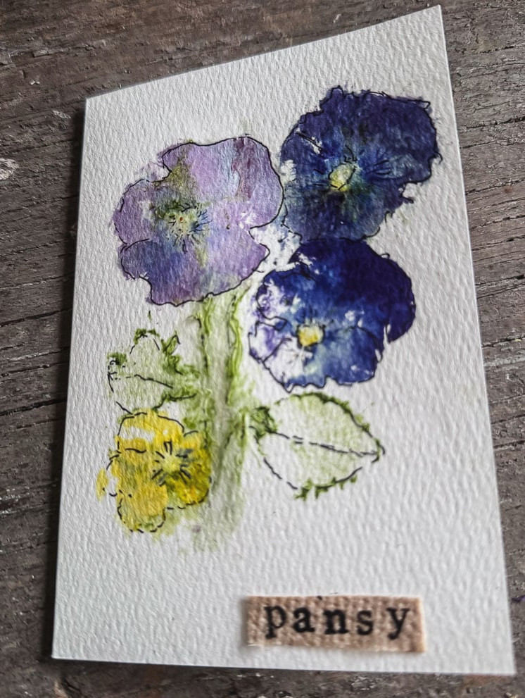 a handmade notecard with pansies