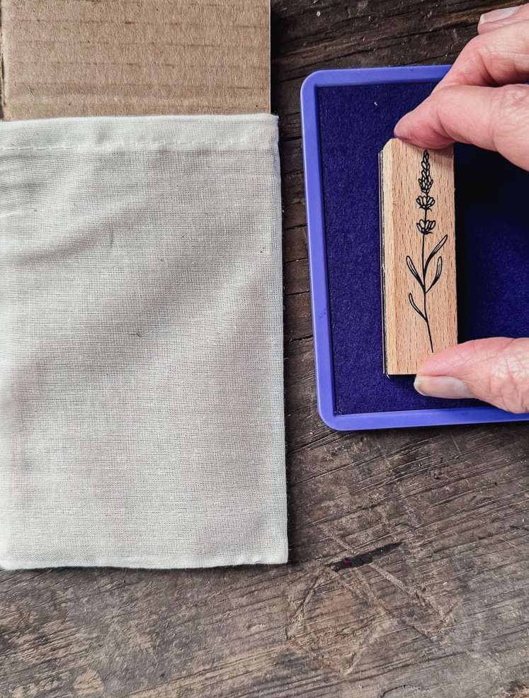 purple ink pad and a flower stamp