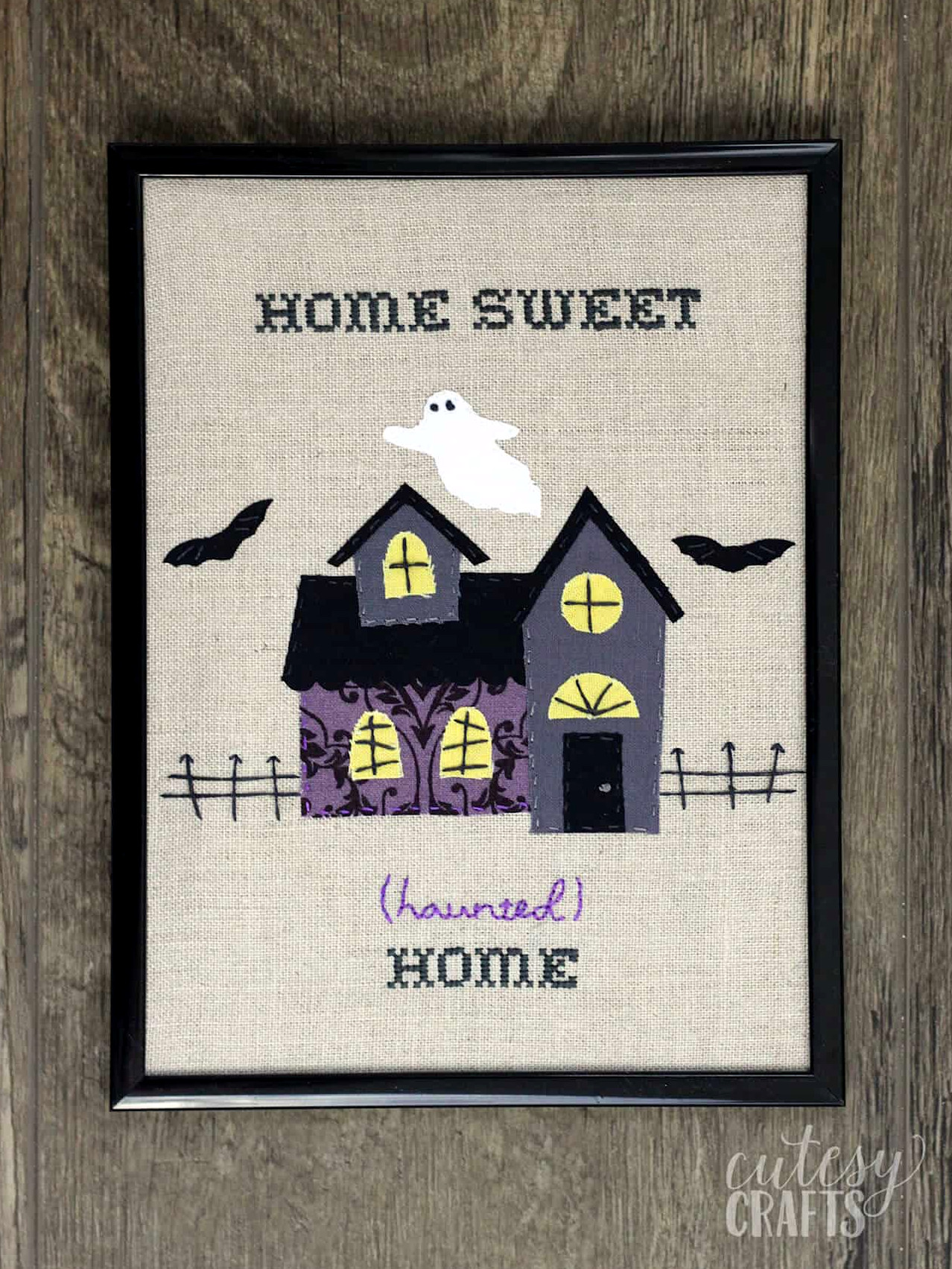haunted mansion embroidery in a frame