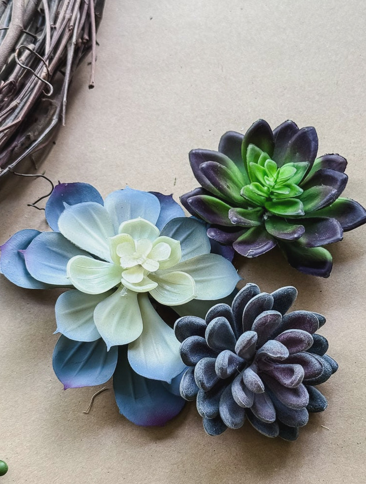rosette artificial succulents on brown paper