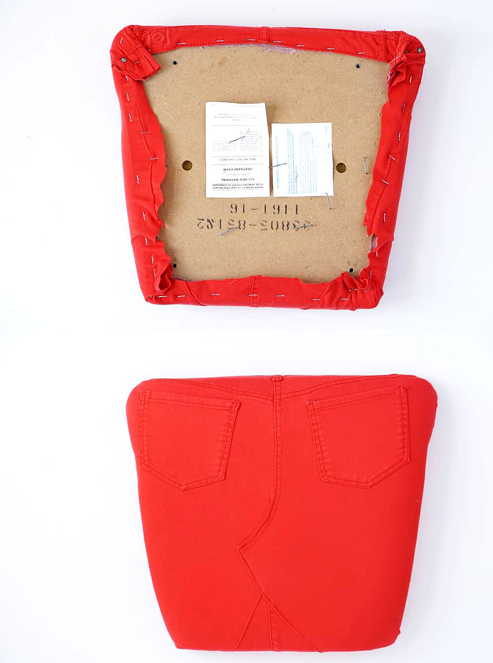 Underside of a chair cushion showing stapled denim