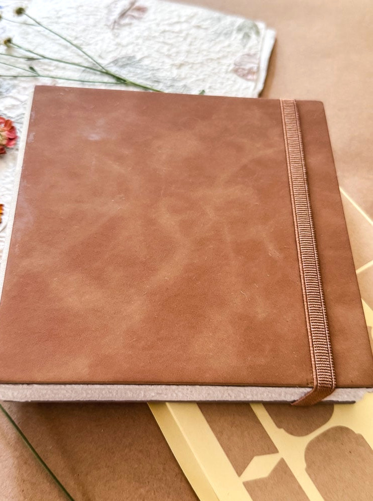 a brown leather book
